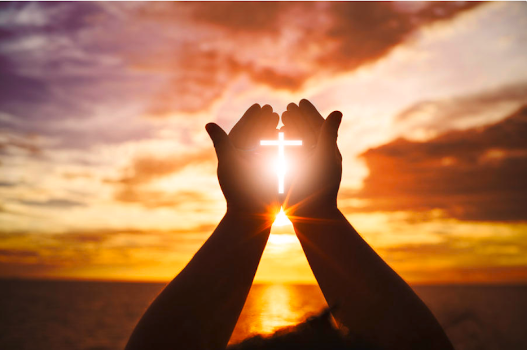 Glowing-Cross-in-Hand