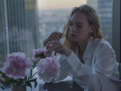 Sad woman sitting near window