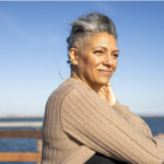 Woman contemplating near the water copy