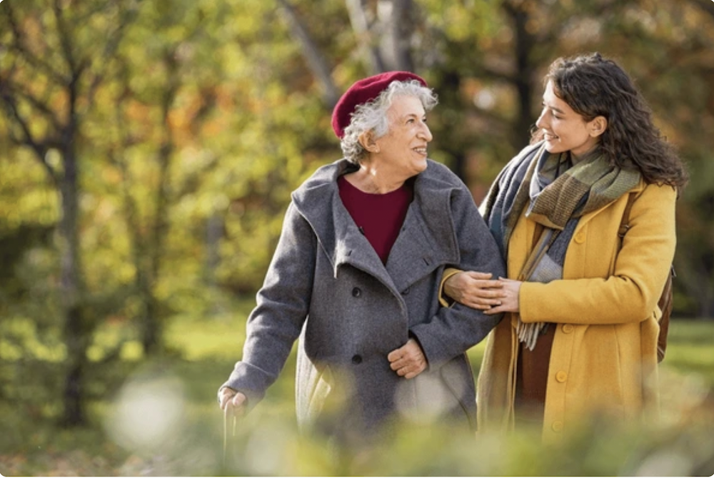 Young Woman Helping an Older Woman copy