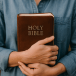 Woman holding a Bible close to her heart