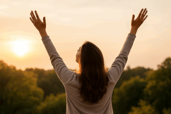Woman raising hands to the sky in worship copy